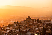 Atmospheric sunset above historic Albaicin and Iglesia de San Cristobal, UNESCO, viewed from San Miguel Alto, Albaicin, Granada, Andalucia, Spain