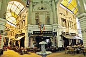 Pasajul Macca-Vilacrosse, yellow glass covered arcaded street in Lipscani district, central Bucharest, Romania