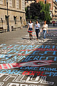 Painted writing on the floor of Franceza street by side of National Museum of Romanian History, Lipscani district, Old City, Bucharest, Romania