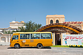 School bus in front of a school, Al Sharqiyah region, Sultanate of Oman, Arabian Peninsula