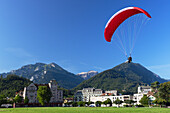 Paraglider over Hohematte Park, Interlaken, Bernese Oberland, Switzerland