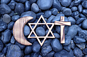 Christianity, Islam and Judaism symbols, three monotheistic religions, Jewish Star of David, Christian Cross and Muslim Crescent, Indonesia