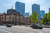 View of Tokyo Station and Chiyoda's Marunouchi business district backdrop on a sunny day, Chiyoda, Tokyo, Honshu, Japan