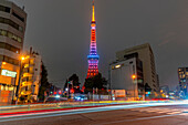 View of Tokyo Tower and city buildings at night, Minato City, Tokyo, Honshu, Japan