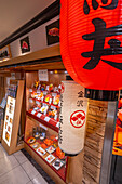 View of colourful frontage of restaurant in Omicho Market, Kanazawa City, Ishikawa Prefecture, Honshu, Japan