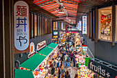 Elevated view of stalls and people in Omicho Market, Kanazawa City, Ishikawa Prefecture, Honshu, Japan