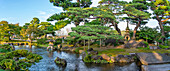 View of Japanese stone lantern and pagoda in Kenrokumachi Japanese Garden, Kanazawa City, Ishikawa Prefecture, Honshu, Japan