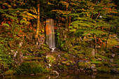 View of Hisago-ike Pond and waterfall in Kenrokumachi Japanese Garden, Kanazawa City, Ishikawa Prefecture, Honshu, Japan