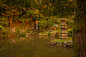 View of Hisago-ike Pond, Kaiseki Pagoda and waterfall in Kenrokumachi Japanese Garden, Kanazawa City, Ishikawa Prefecture, Honshu, Japan