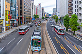 Elevated view of traffic and tram on major street during daytime, Hondori, Naka Ward, Hiroshima, Honshu, Japan