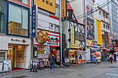 View of restaurants and shops in Dotonbori, vibrant entertainment district near the river, Osaka, Honshu, Japan