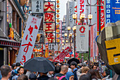 View of colourful signs of restaurants in Dotonbori, vibrant entertainment district near the river, Osaka, Honshu, Japan