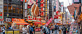 View of colourful signs of restaurants in Dotonbori, vibrant entertainment district near the river, Osaka, Honshu, Japan