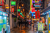 View of colourful signs in backstreet in Dotonbori, vibrant entertainment district near the river, Osaka, Honshu, Japan