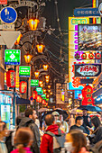 View of colourful signs in backstreet in Dotonbori, vibrant entertainment district near the river, Osaka, Honshu, Japan