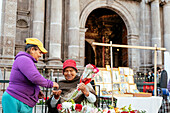 Flower vendor outside church, Quito, Ecuador