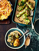 Vegetarian cabbage rolls with herb and mushroom filling and pumpkin gratin