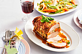 Stuffed roast pork with vegetables