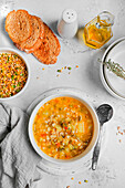 Spelt and pulses soup with carrots, potatoes and rye bread