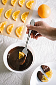 Candied oranges are dipped in dark chocolate