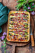 Tart with green asparagus wrapped in bacon