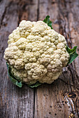Cauliflower 'Brassica oleracea var botrytis' on garden table