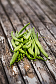 Freshly harvested green beans on the garden table