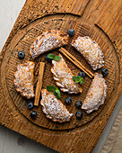 Empanadillas with blueberry filling and cinnamon