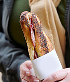 Baguette sandwich with salami at a market in Lyon