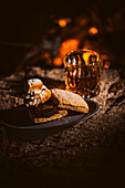 S'mores with toasted marshmallows, chocolate and whisky drink