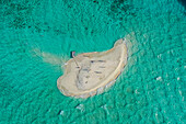 Aerial view of people with a boat on a small island with white sand,Thinadhoo,Vaavu Atoll,Maldives