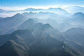 Aerial view of majestic Jinshanling Great Wall amidst serene mountains and tranquil valleys,Luanping County,China