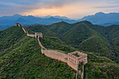 Aerial view of the old great wall amidst majestic mountains and serene landscape,Luanping County,China