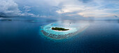 Panoramic aerial view of Gaathu Sushi Atoll surrounded by the Indian Ocean,Maldives