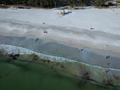 Aerial view of a beautiful beach with a lifeguard house and people enjoying the sunny day,Bradenton Beach,United States