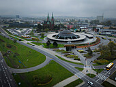 Aerial view of the church of the holy cross and bus station amidst urban architecture and greenery,Kielce,Poland