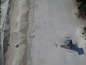 Aerial view of a beautiful beach with a lifeguard house,people enjoying the sunny shore,Bradenton Beach,United States