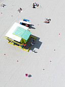 Aerial view of beautiful beach with lifeguard house and people sunbathing,Miami Beach,United States