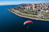 Aerial view of paramotor flying near park in Maltepe district on the Marmara Sea coast of the Asian side of Istanbul,Turkey