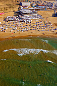 Aerial view of a beautiful sandy beach with people enjoying the sunny shoreline and waves of the Black Sea,Sariyer,Turkey