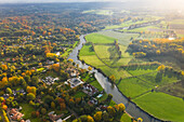 Aerial view of houses with view on agricultural land in autumn,in Belgium
