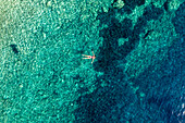 Aerial view of tranquil turquoise sea with clear water and people swimming,Ston,Croatia