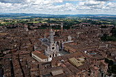Aerial view of the historic medieval town with beautiful architecture and the iconic cathedral in the main square,Siena,Italy