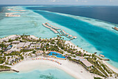 MALE,MALDIVES - 4 SEPTEMBER 2021: Aerial View Of Luxury Tropical Island Resort Surrounded By Clear Blue Ocean In The South Male Atoll,Maldives