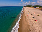Aerial view of Yalikoy beach with sandy shore and people relaxing under umbrellas,Catalca,Turkey