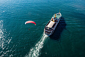 Aerial view of paramotor flying over a ferry boat in Marmara Sea,Istanbul,Turkey