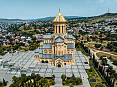 Aerial view of the beautiful Holy Trinity Cathedral amidst a scenic cityscape and hills,Avlabari,Georgia