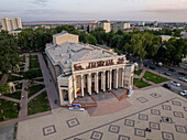 Aerial view of the beautiful historic theater and urban park in the city square surrounded by trees,Khujand,Tajikistan
