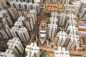 Aerial view of a boat shopping mall with symmetrical apartment blocks in WanChai,Hong Kong