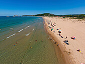 Aerial view of a beautiful sandy beach with people and colorful umbrellas along the coastline of the Black Sea,Sile,Turkey